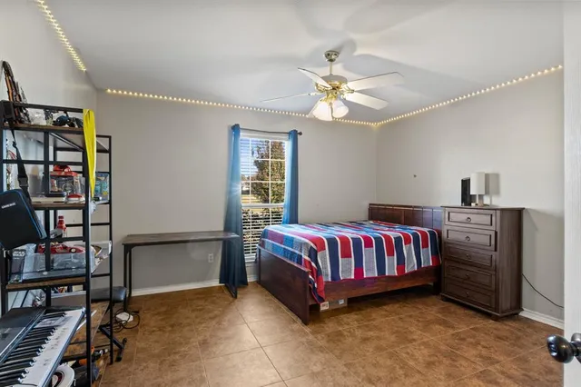 a bedroom with a bed and a book shelf