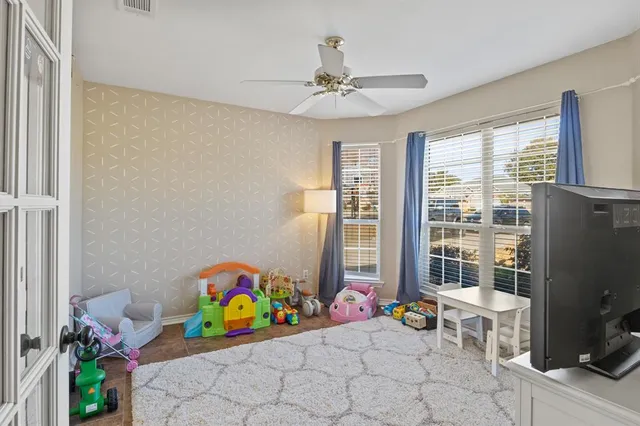 a room with furniture and a flat screen tv