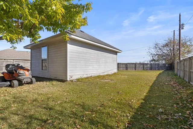 a backyard of a house with lots of green space