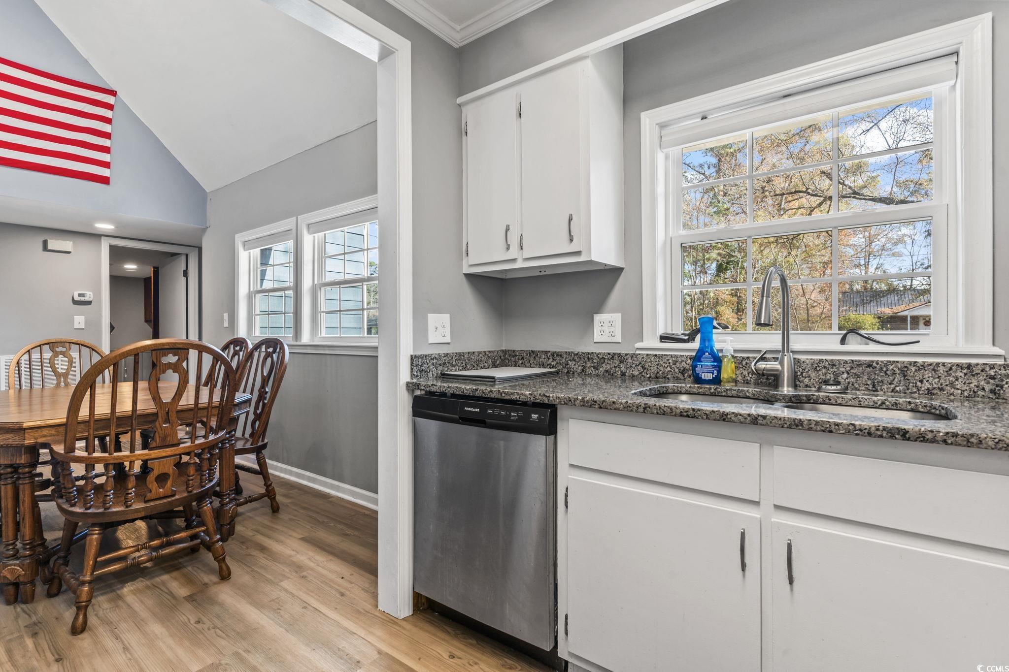 109 Clemson Road Conway, SC 29526 - Photo 3 of 25 Kitchen with vaulted ceiling, white cabinetry, sin