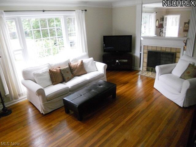 2441 Channing Road Cleveland, OH 44118 - Photo 2 of 16 Living Room with Gleaming Hardwood Floors, Fireplace and Newer Windows