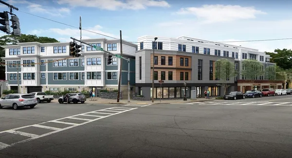 a city street lined with buildings and cars