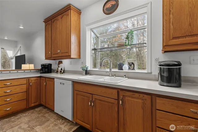 a kitchen with a sink and a window