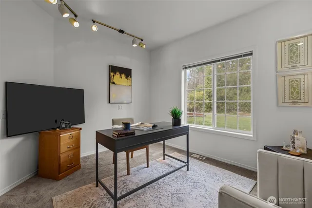 a workspace with furniture and window