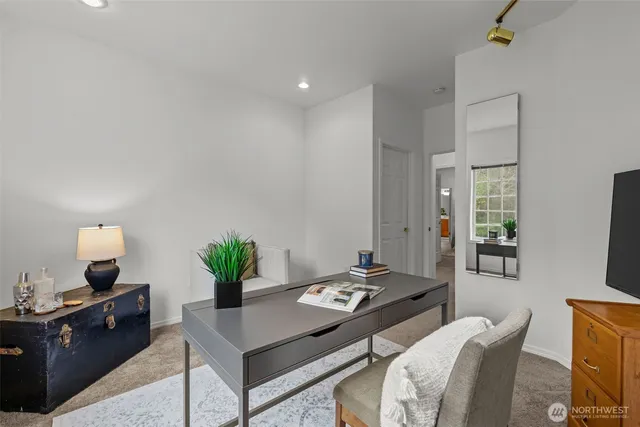 a view of a workspace with furniture