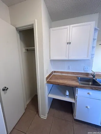 a room that has a sink and a mirror