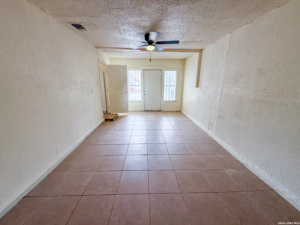 a view of an empty room and window