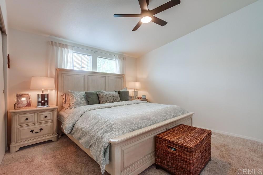 120 Brookside Lane Oceanside, CA 92056 - Photo 23 of 55 a bedroom with a bed and a cabinets