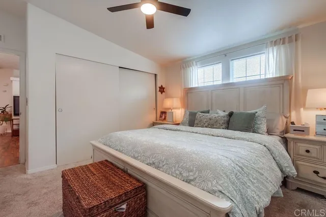 a bedroom with a bed and a flat screen tv in a bedroom