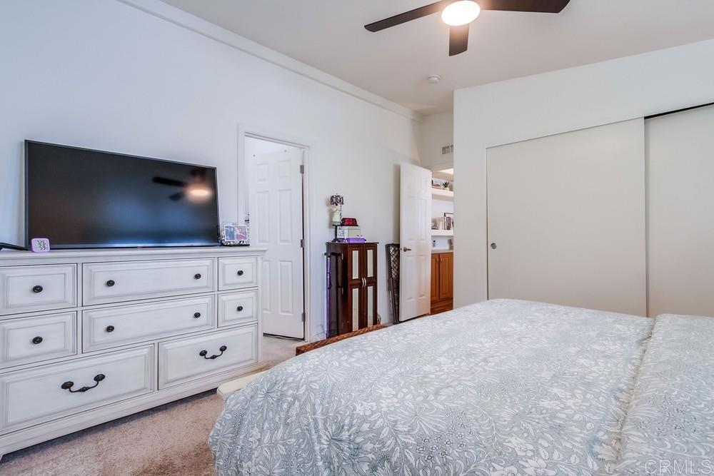 120 Brookside Lane Oceanside, CA 92056 - Photo 25 of 55 a bedroom with a bed and a flat screen tv in a bedroom