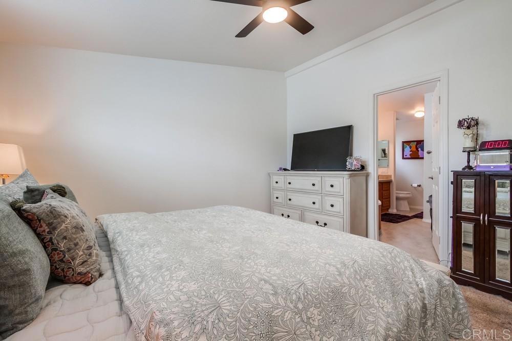 120 Brookside Lane Oceanside, CA 92056 - Photo 27 of 55 a bedroom with a bed and a flat screen tv