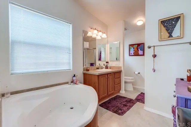 a bathroom with a sink double vanity and a mirror