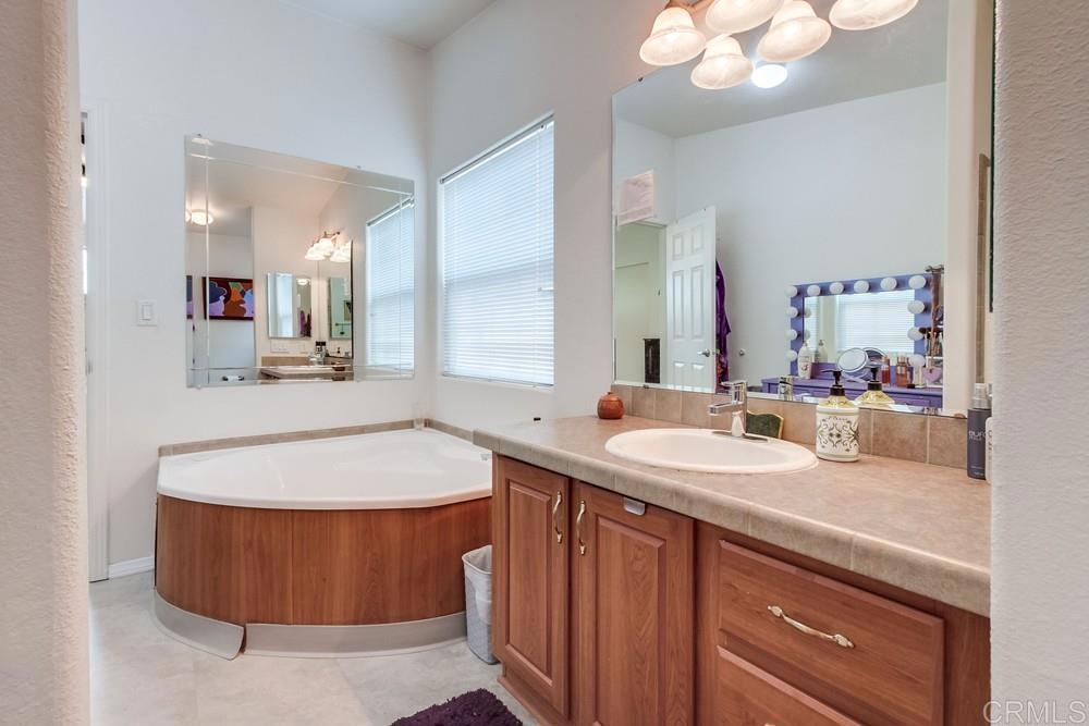 120 Brookside Lane Oceanside, CA 92056 - Photo 29 of 55 a bathroom with a sink double vanity and a mirror