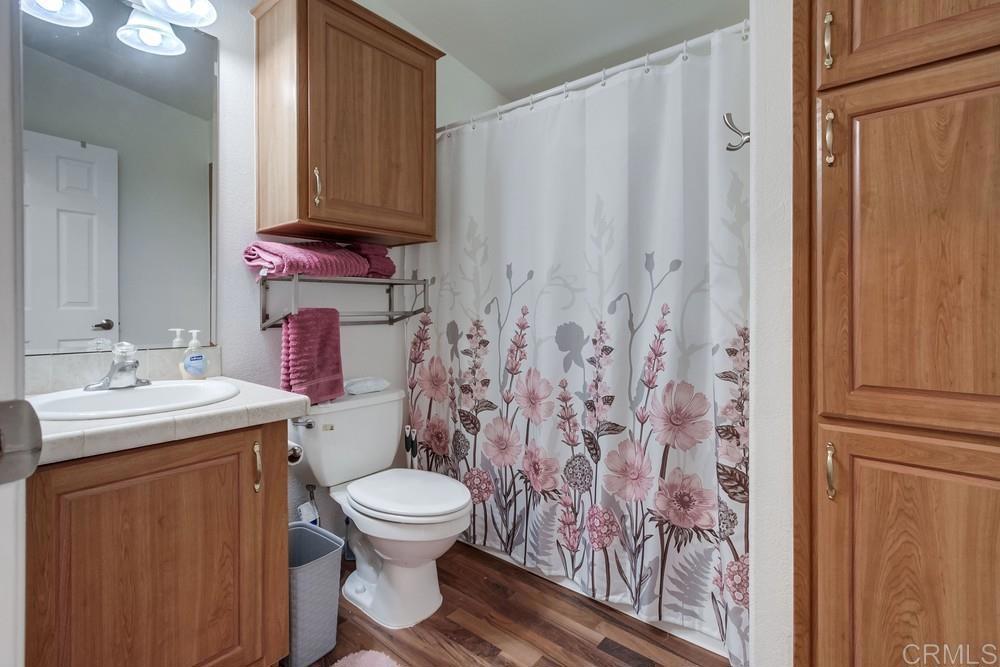 120 Brookside Lane Oceanside, CA 92056 - Photo 39 of 55 a bathroom with a sink toilet and shower