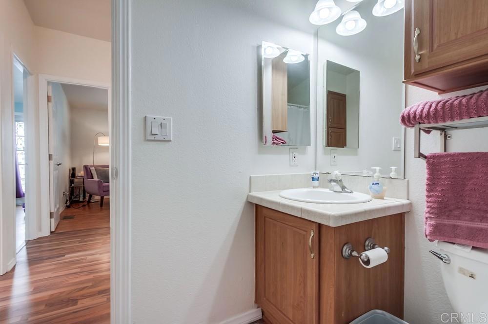 120 Brookside Lane Oceanside, CA 92056 - Photo 41 of 55 a en suite bathroom with a sink and a mirror