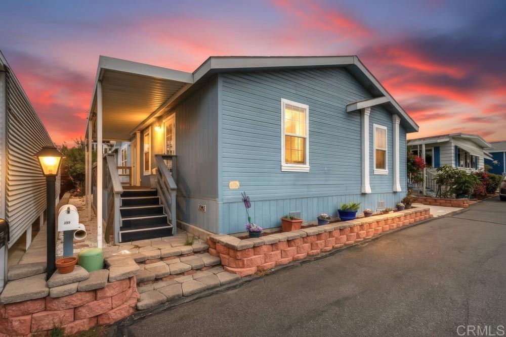 120 Brookside Lane Oceanside, CA 92056 - Photo 44 of 55 a front view of a house with a garage