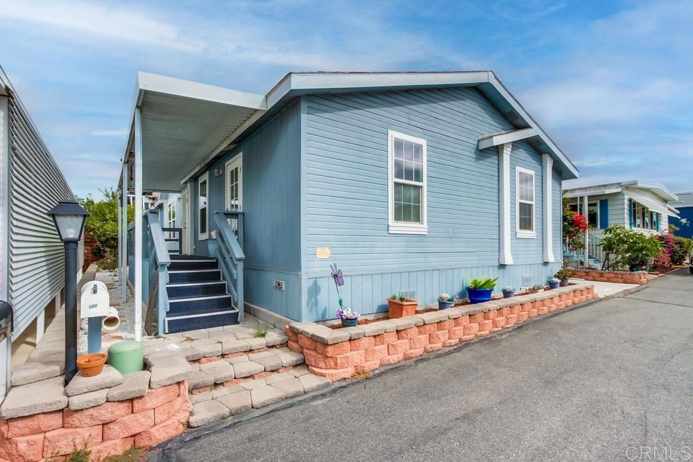 120 Brookside Lane Oceanside, CA 92056 - Photo 6 of 55 a front view of a house with street