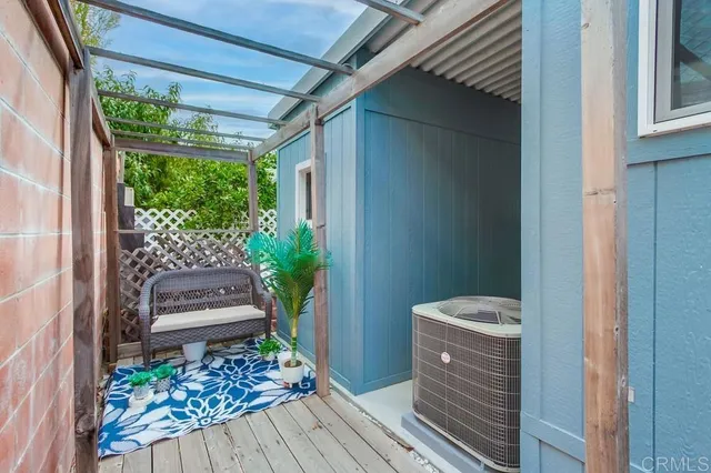 a living room with furniture and a lamp