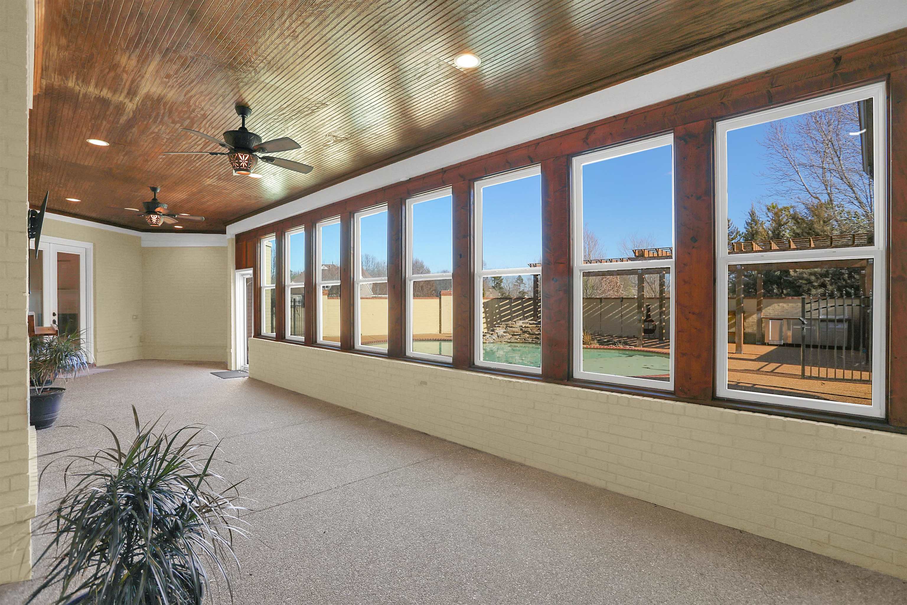 105 Parkview Drive Piperton, TN 38017 - Photo 15 of 25 a view of an entryway with a floor to ceiling window and potted plants