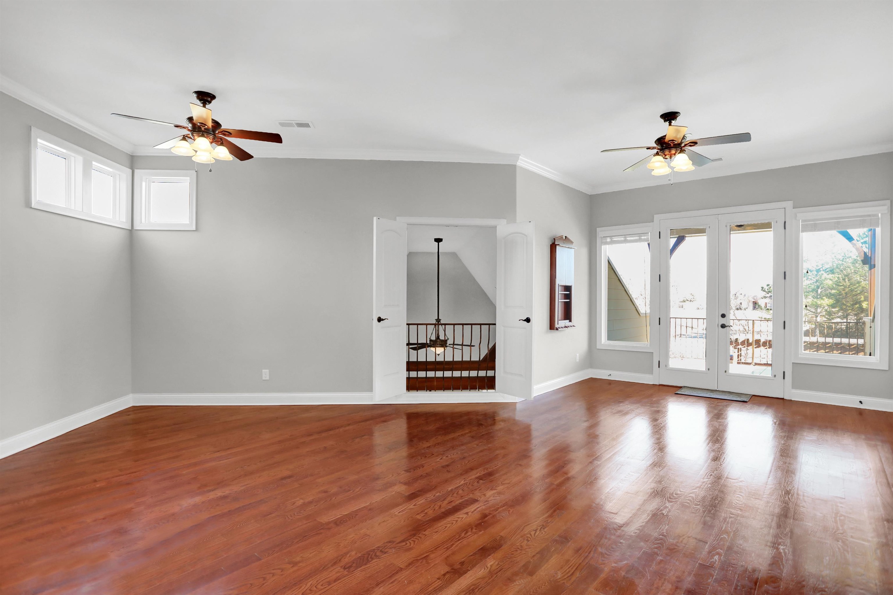 105 Parkview Drive Piperton, TN 38017 - Photo 17 of 25 a view of an empty room with wooden floor fan and a window