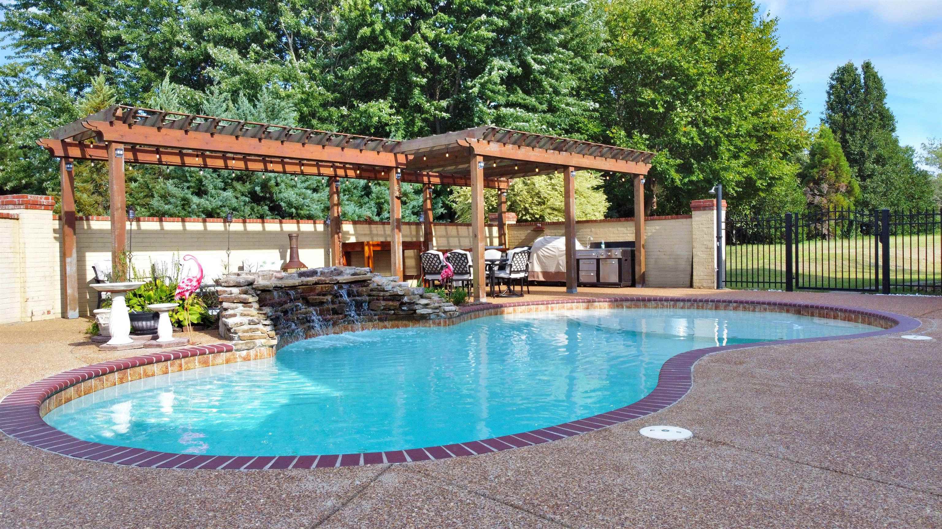 105 Parkview Drive Piperton, TN 38017 - Photo 24 of 25 a view of a swimming pool with a sitting space