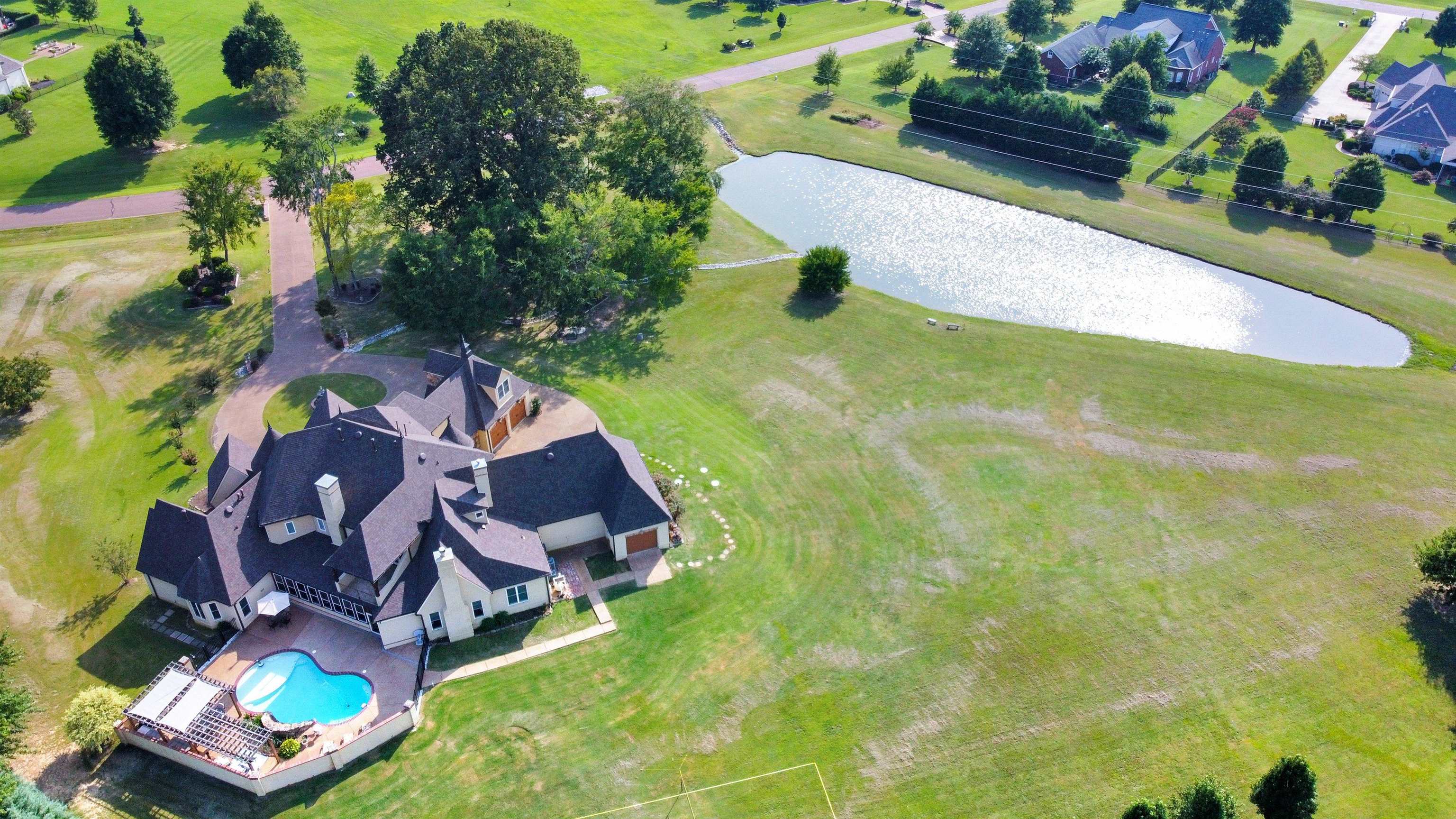 105 Parkview Drive Piperton, TN 38017 - Photo 25 of 25 an aerial view of a house with a garden and swimming pool