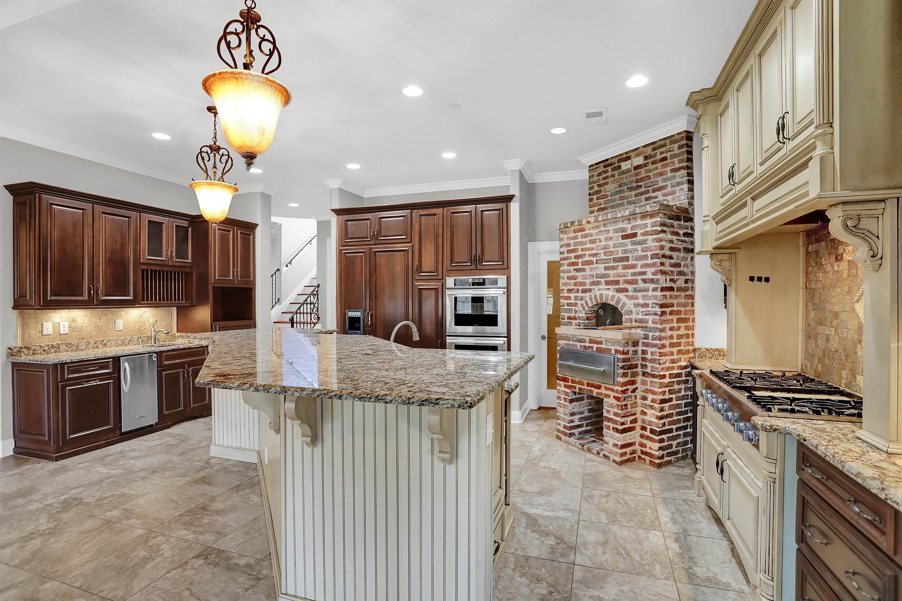 105 Parkview Drive Piperton, TN 38017 - Photo 5 of 25 a kitchen with stainless steel appliances granite countertop a stove oven a sink dishwasher and a refrigerator with wooden cabinets
