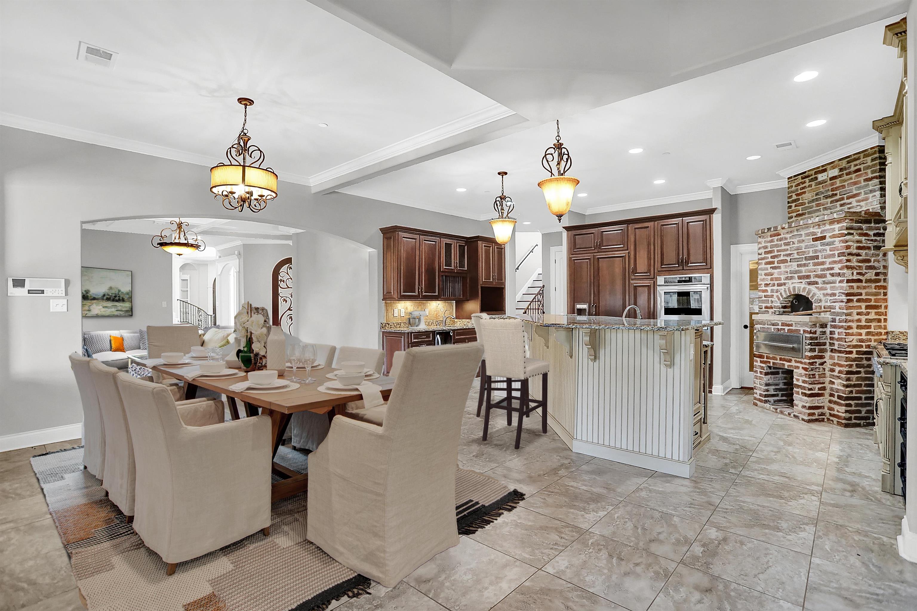 105 Parkview Drive Piperton, TN 38017 - Photo 6 of 25 a living room with furniture a dining table and a chandelier