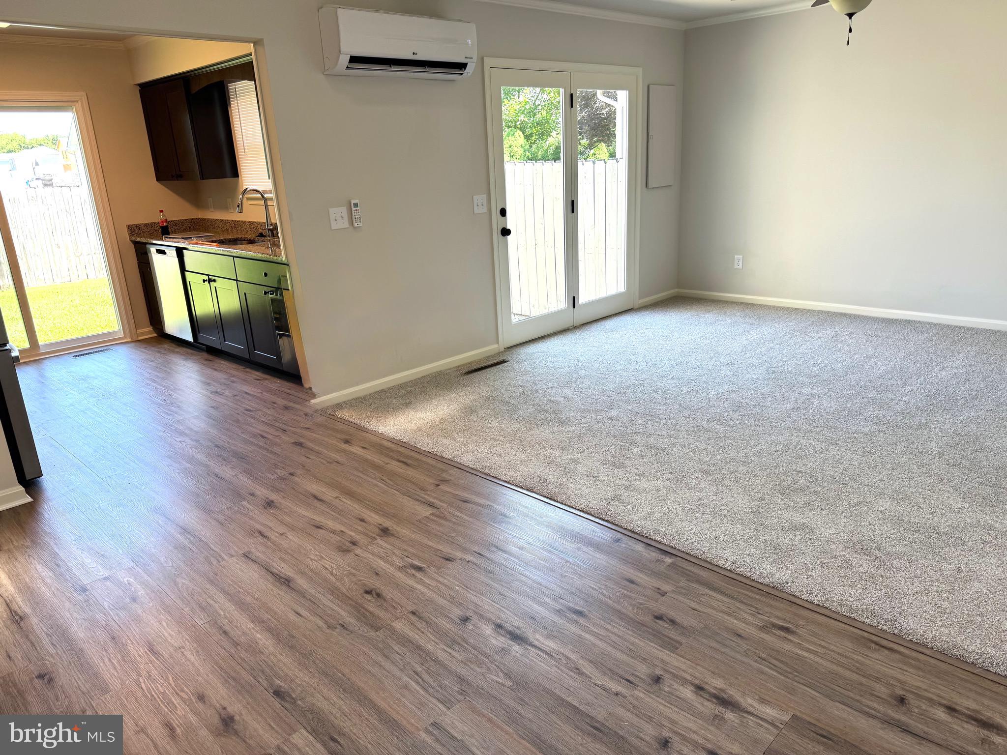 19 Crossgate Drive Seaford, DE 19973 - Photo 14 of 20 a view of an empty room with window and wooden floor