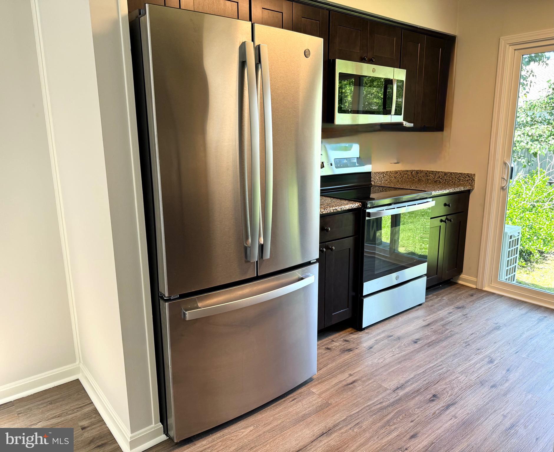 19 Crossgate Drive Seaford, DE 19973 - Photo 3 of 20 a kitchen with stainless steel appliances a refrigerator and a stove