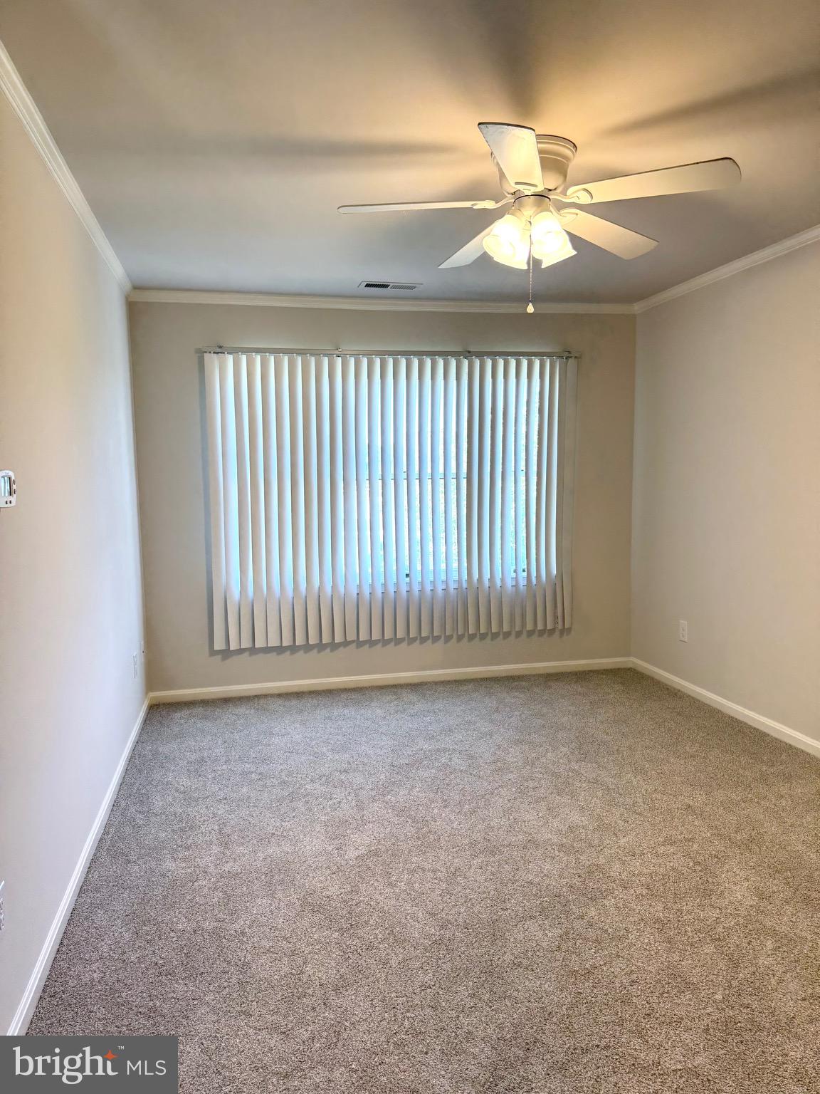 19 Crossgate Drive Seaford, DE 19973 - Photo 9 of 20 en empty room with windows and stairs