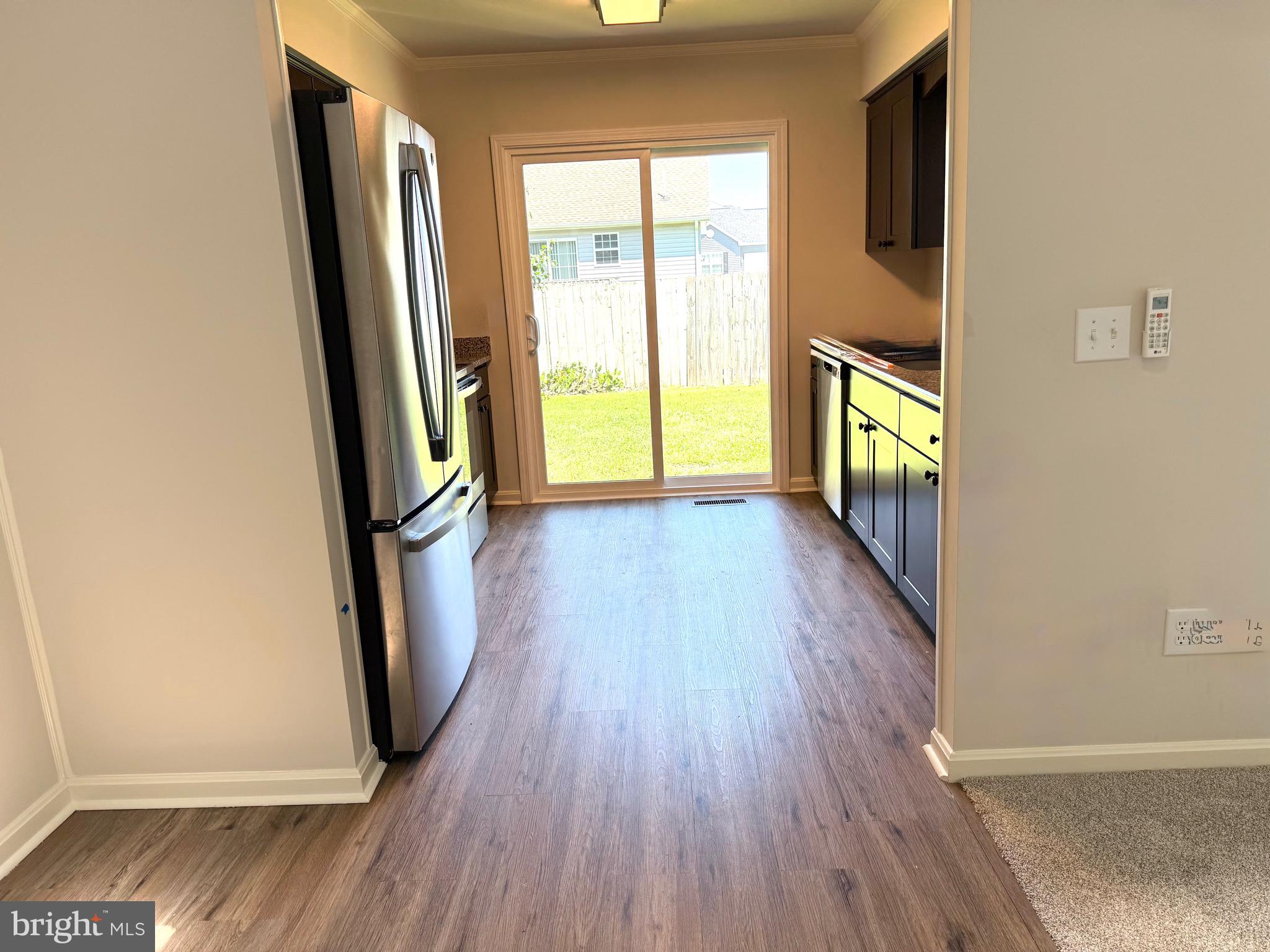 19 Crossgate Drive Seaford, DE 19973 - Photo 10 of 20 an empty room with wooden floor and windows