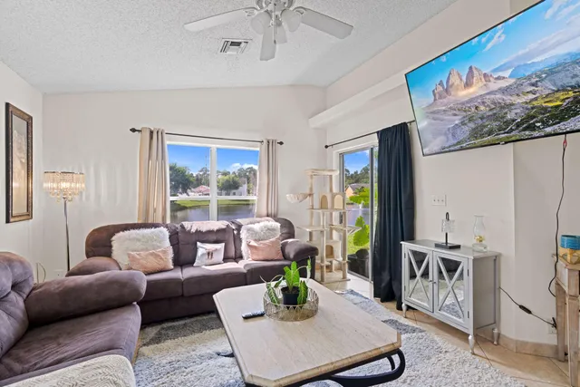 a living room with furniture rug and window