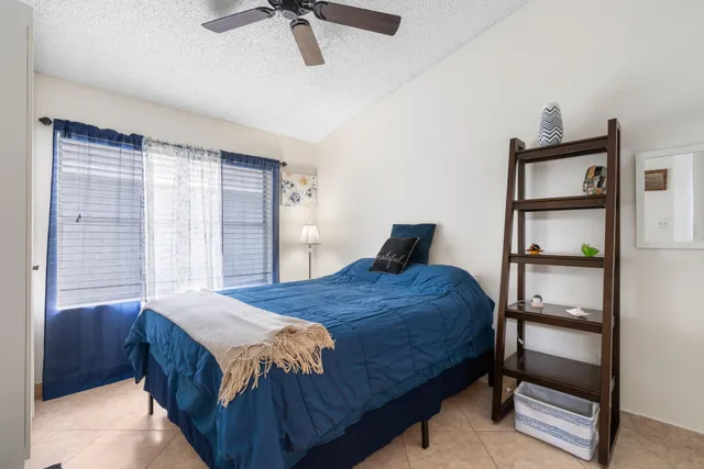 a bedroom with a bed and a cabinets