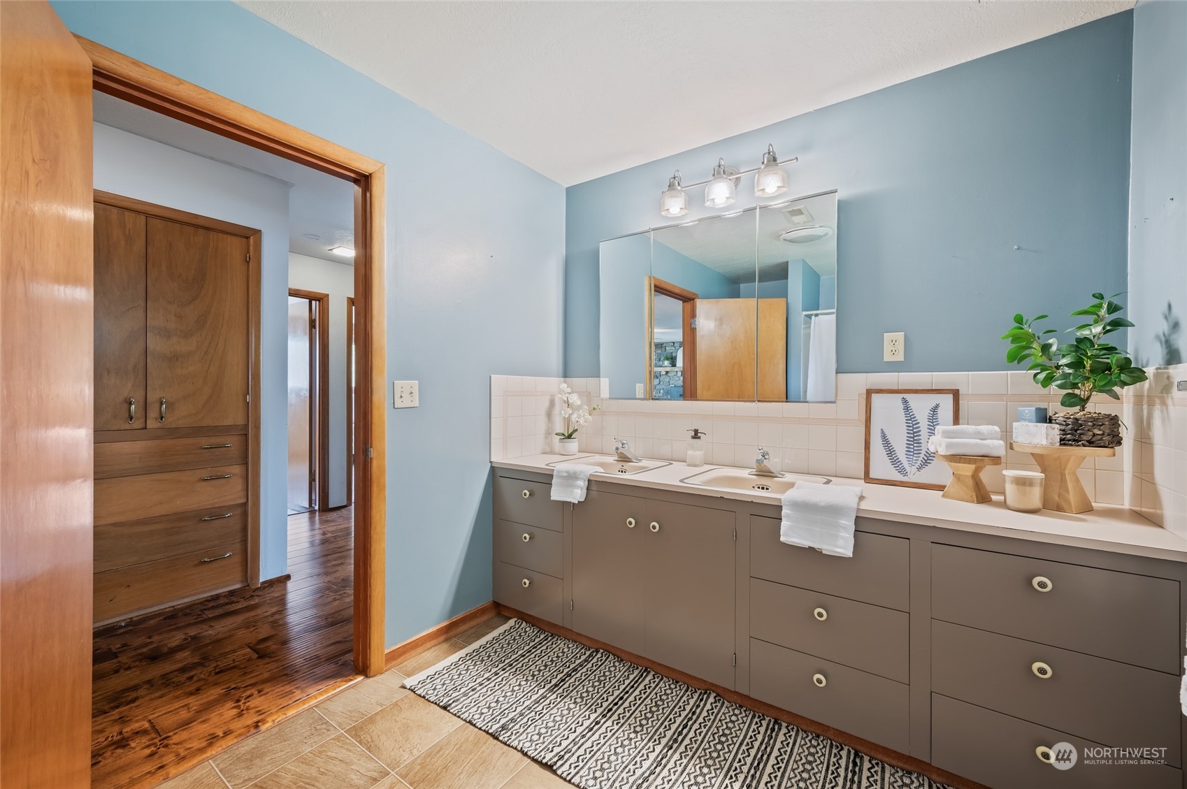 8251 Riverview Road Peshastin, WA 98847 - Photo 7 of 19 a bathroom with a double vanity sink and mirror