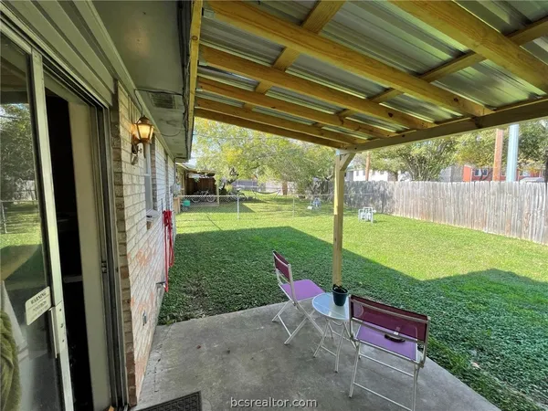 a view of yard with outdoor seating