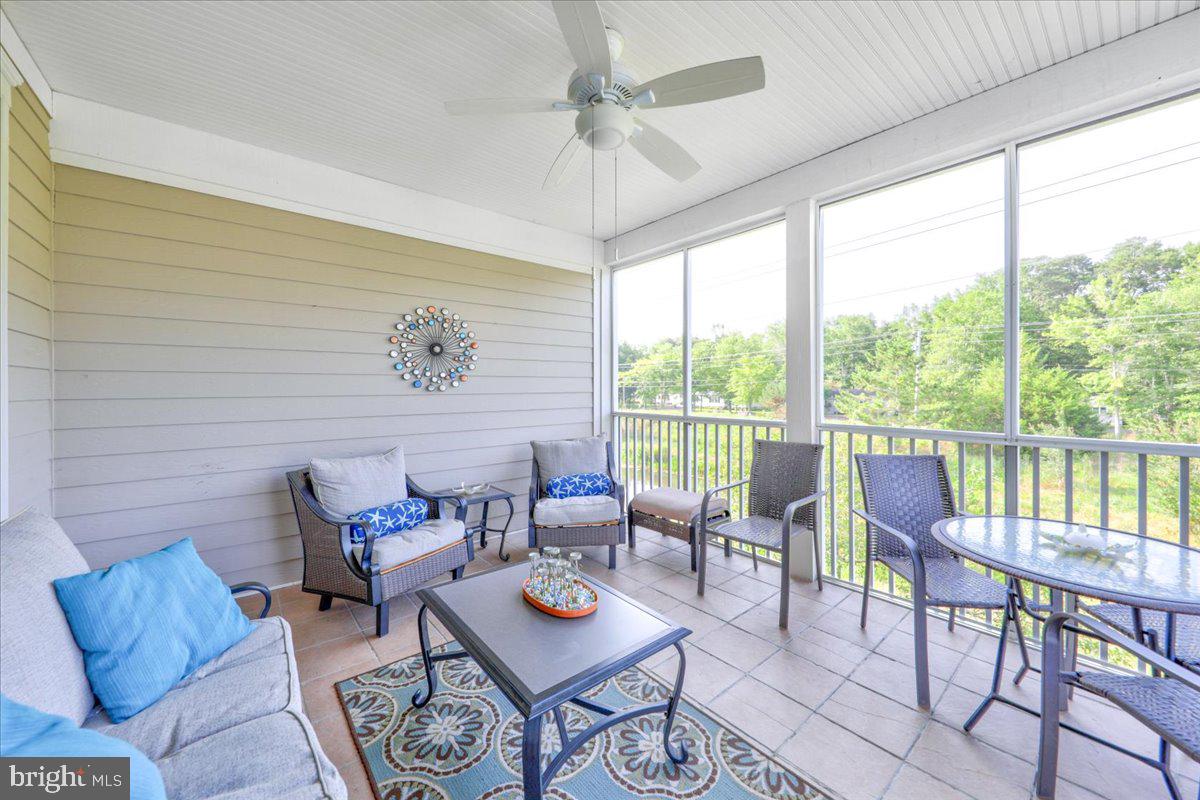 132 October Glory Avenue, Unit F Ocean View, DE 19970 - Photo 7 of 23 Screened porch