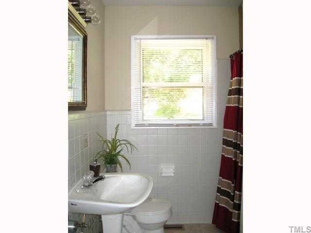 3819 Corwin Road Garner, NC 27529 - Photo 8 of 12 Second full bath on first floor with ceramic tile wall