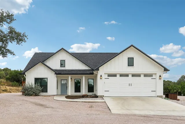 a front view of a house with a outdoor space
