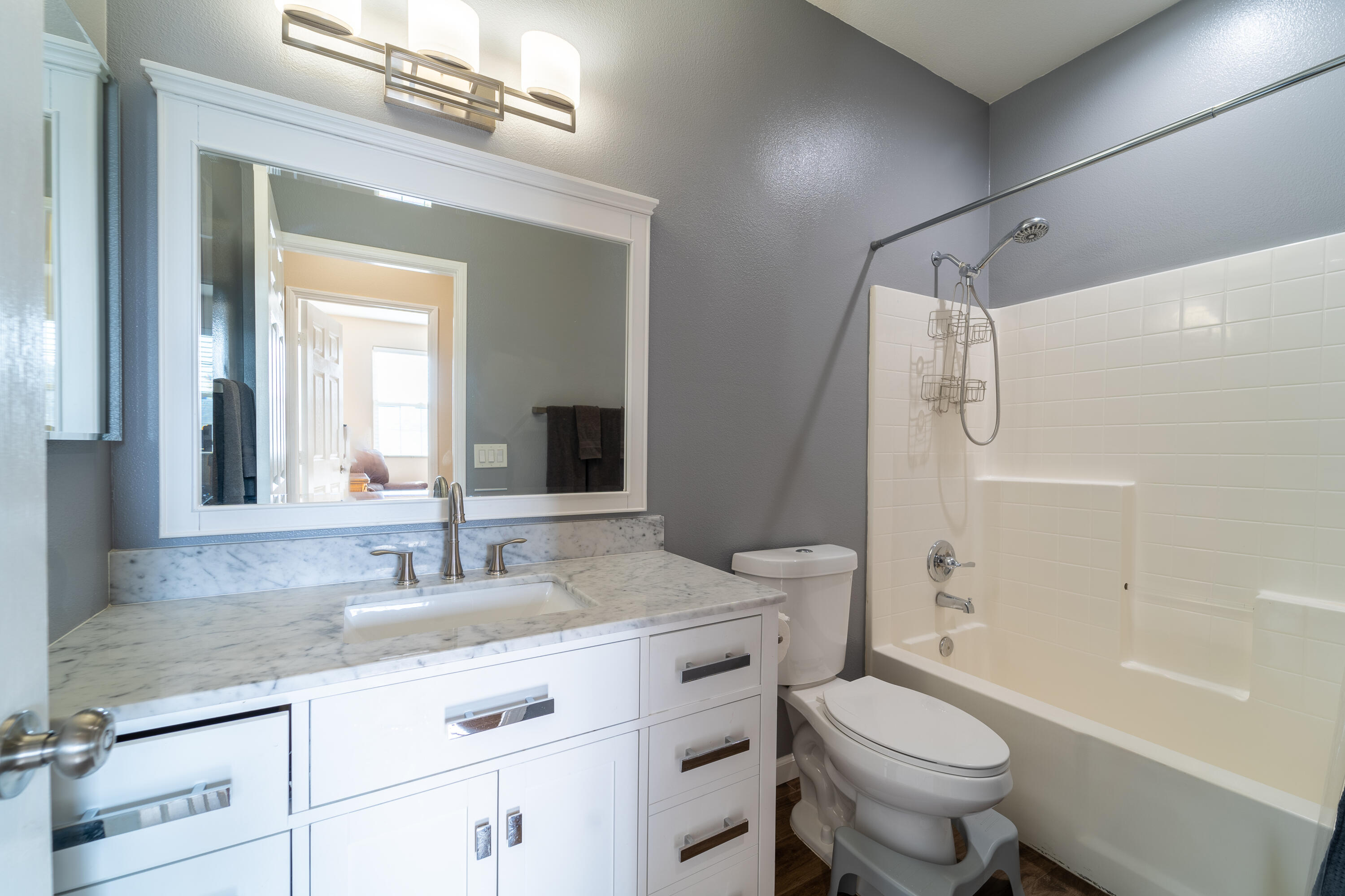47970 Austin Drive Indio, CA 92201 - Photo 15 of 32 a bathroom with a granite countertop sink toilet mirror and shower