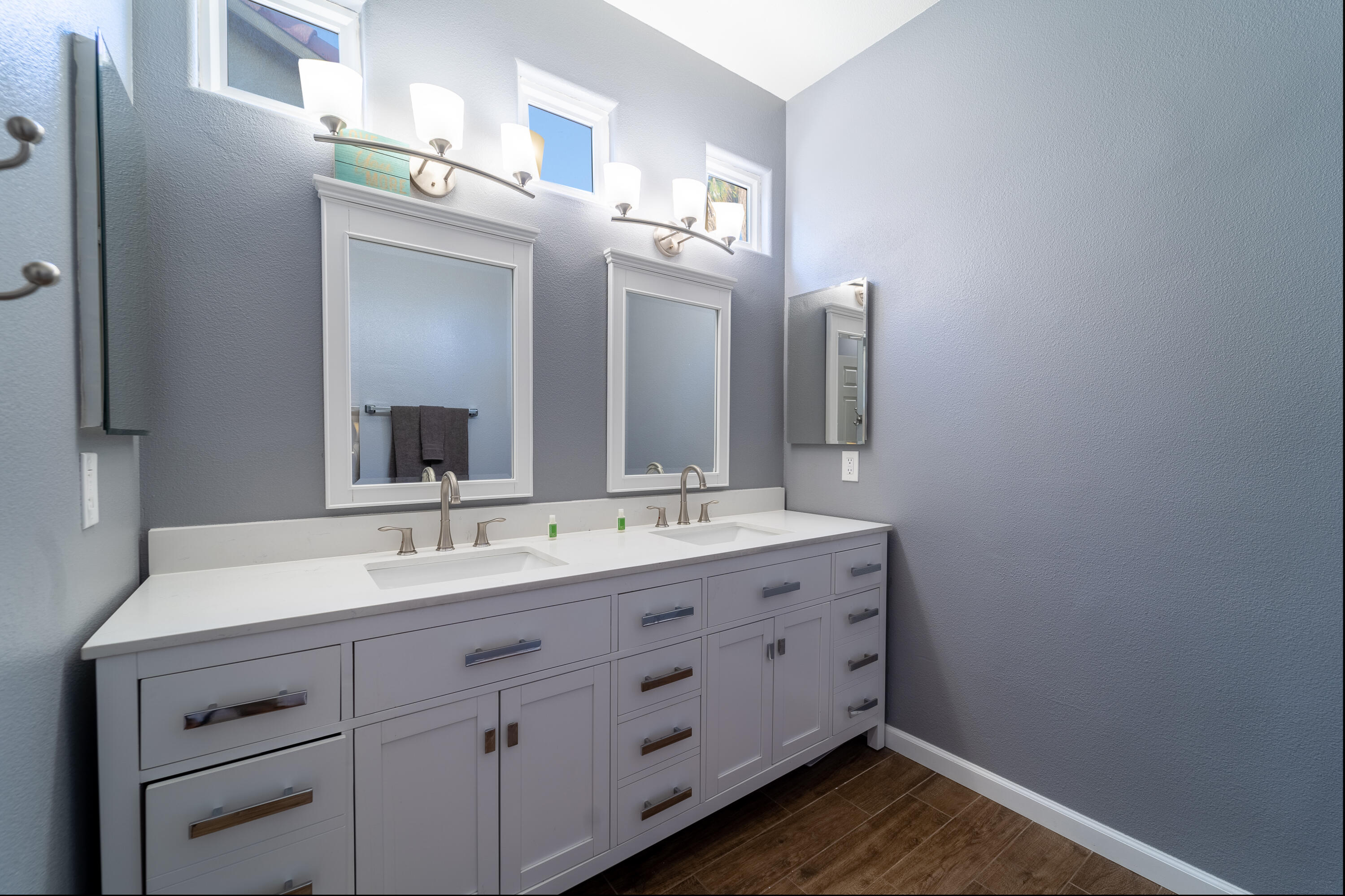 47970 Austin Drive Indio, CA 92201 - Photo 23 of 32 a bathroom with a double vanity sink and mirror