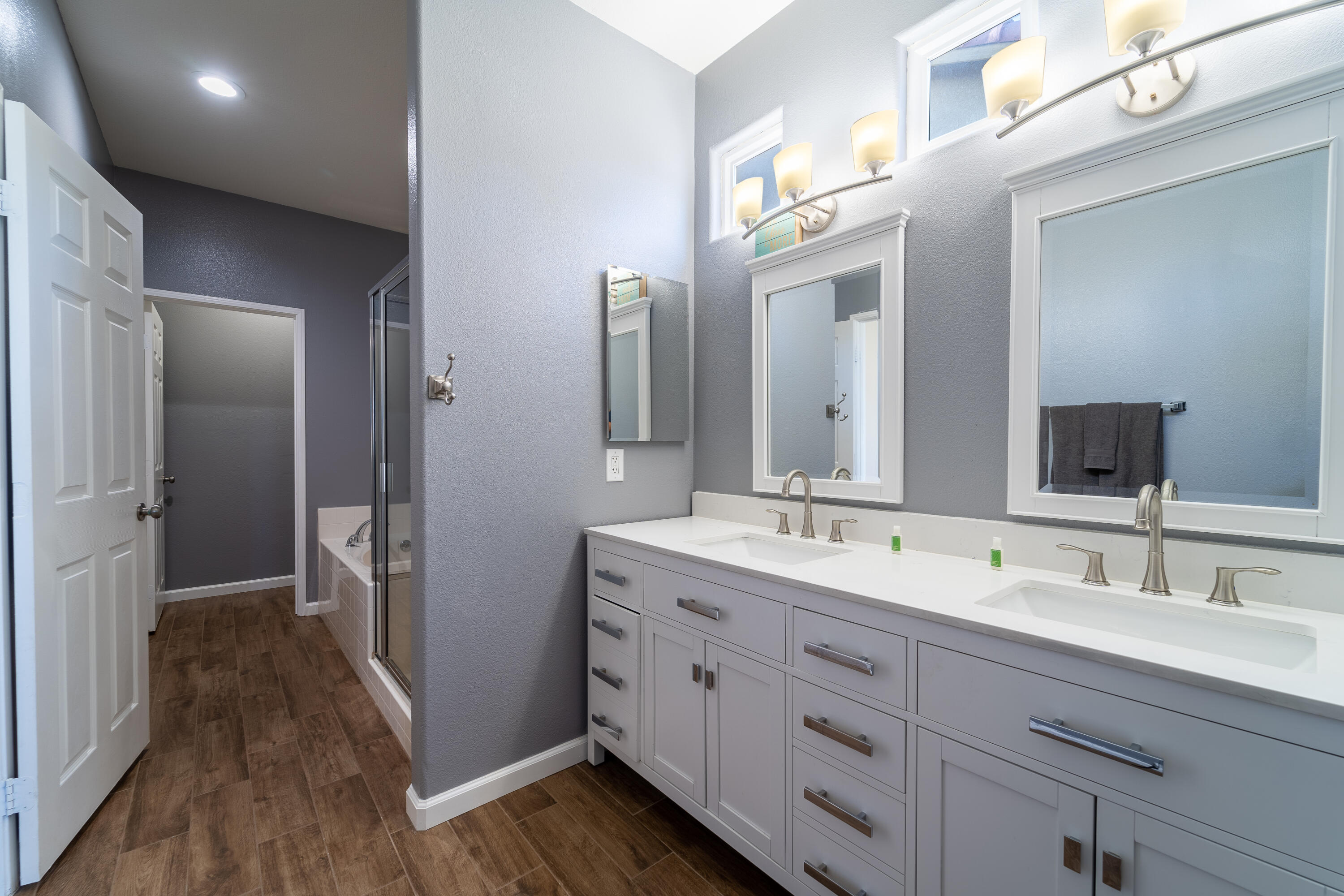 47970 Austin Drive Indio, CA 92201 - Photo 24 of 32 a spacious bathroom with a double vanity sink and a mirror