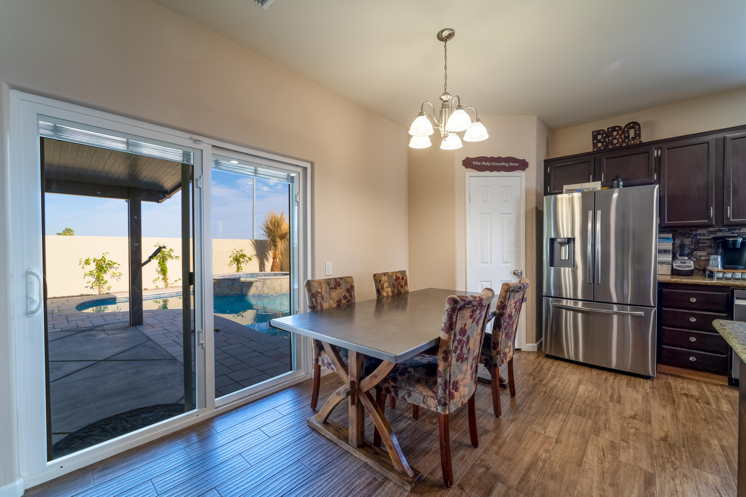 47970 Austin Drive Indio, CA 92201 - Photo 9 of 32 a view of a dining room with furniture window and wooden floor
