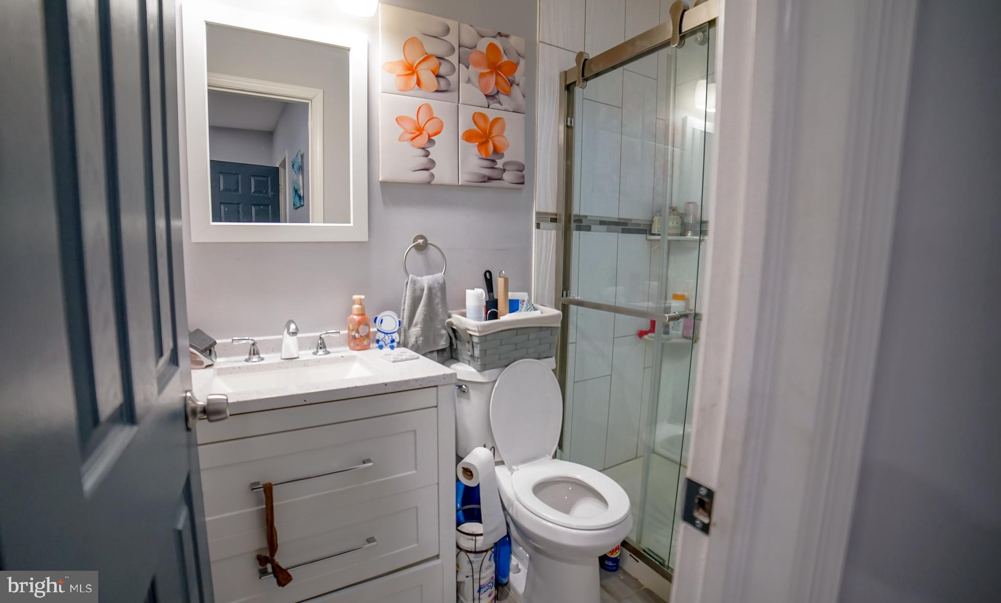 5635 North 10th Street Philadelphia, PA 19141 - Photo 7 of 13 a bathroom with a sink toilet and shower