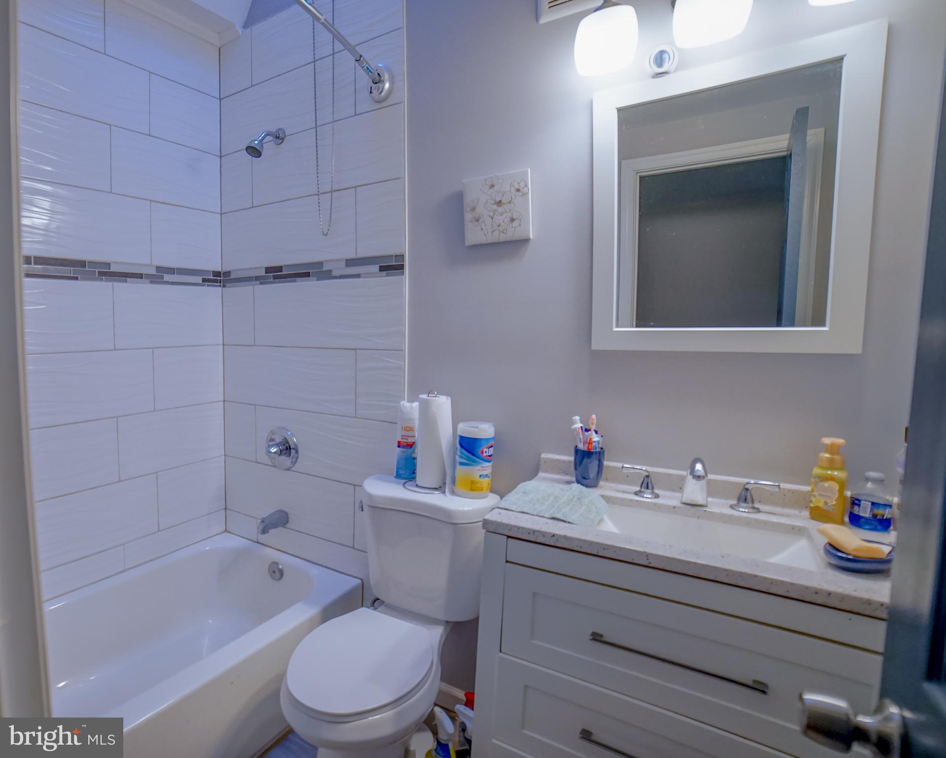 5635 North 10th Street Philadelphia, PA 19141 - Photo 9 of 13 a bathroom with a sink toilet vanity and bathtub