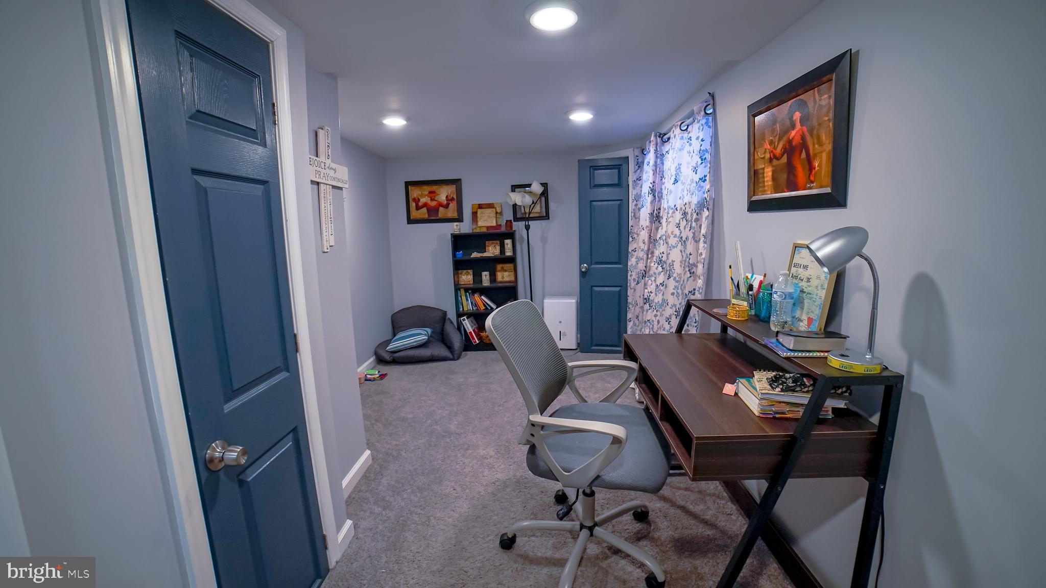 5635 North 10th Street Philadelphia, PA 19141 - Photo 10 of 13 a view of a workspace with furniture and lounge chair