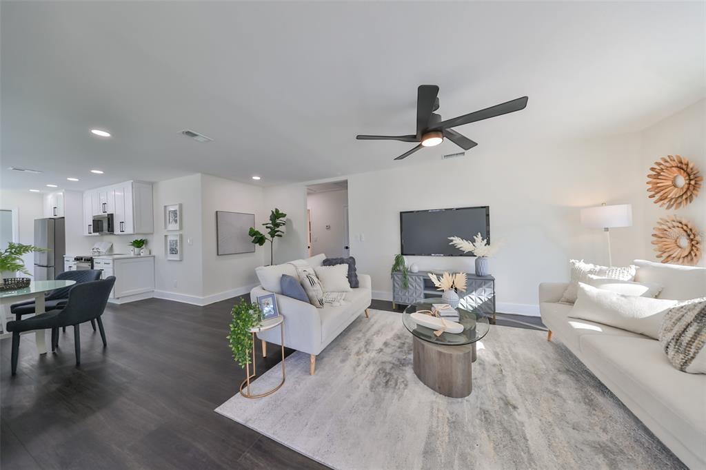 1846 3rd Street South St. Petersburg, FL 33705 - Photo 12 of 40 a living room with furniture wooden floor and a chandelier