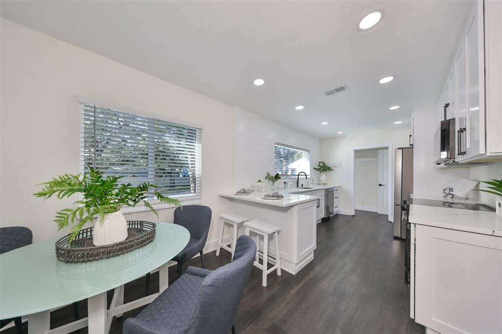 1846 3rd Street South St. Petersburg, FL 33705 - Photo 17 of 40 a kitchen with a table and chairs