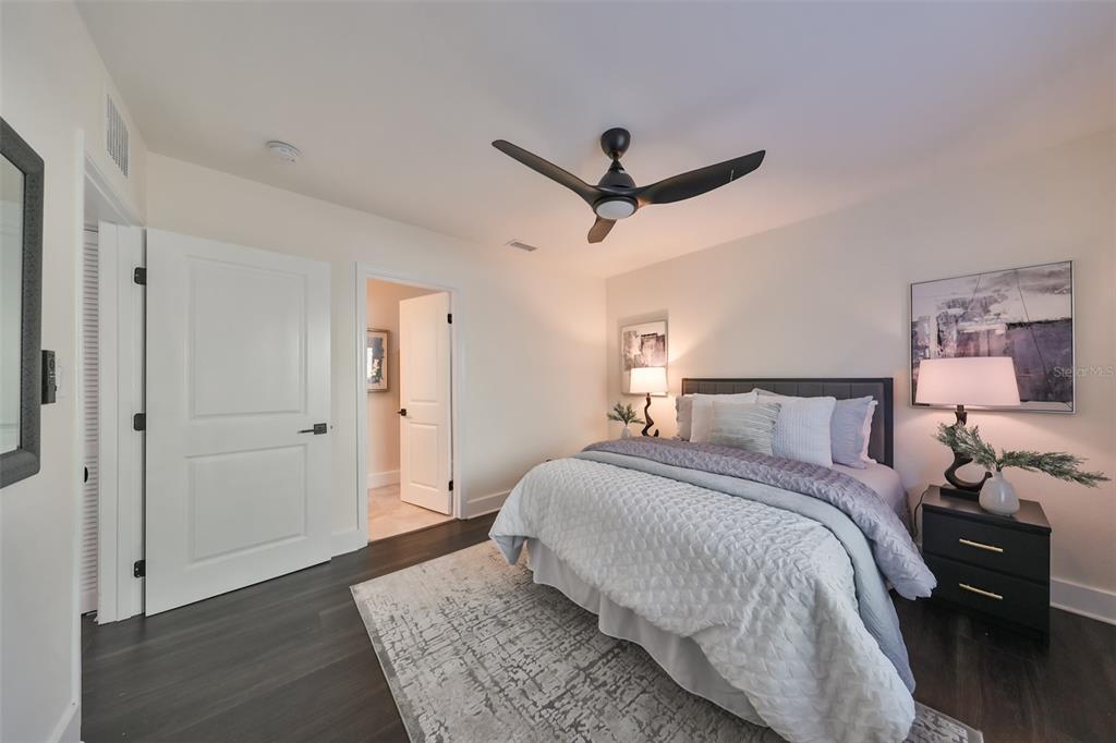 1846 3rd Street South St. Petersburg, FL 33705 - Photo 22 of 40 a bedroom with a bed and wooden floor