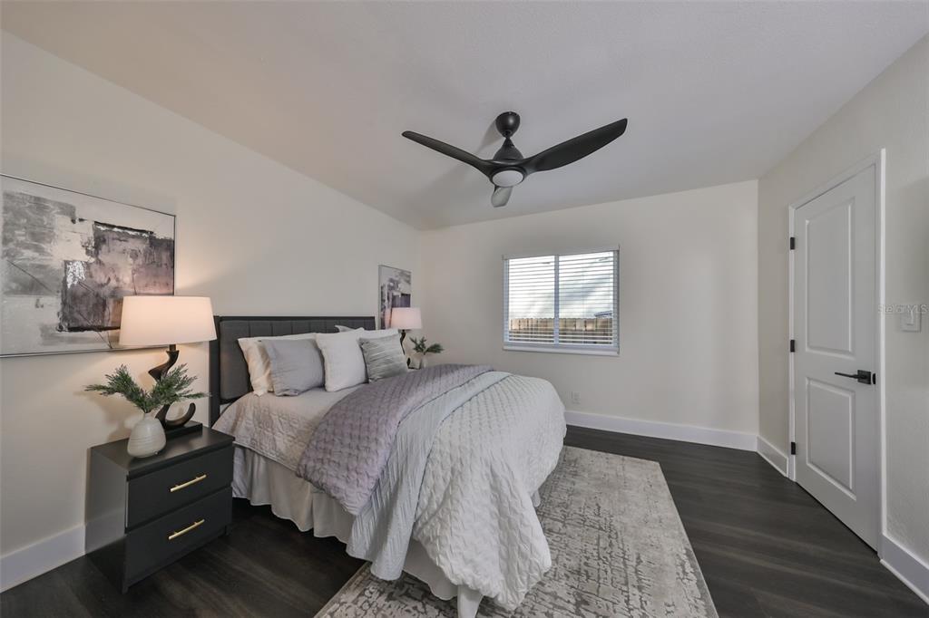 1846 3rd Street South St. Petersburg, FL 33705 - Photo 23 of 40 a bedroom with a bed and wooden floor